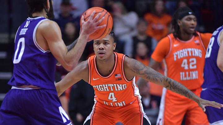 Jan 2, 2024; Champaign, Illinois, USA;  Illinois Fighting Illini guard Justin Harmon (4) guards