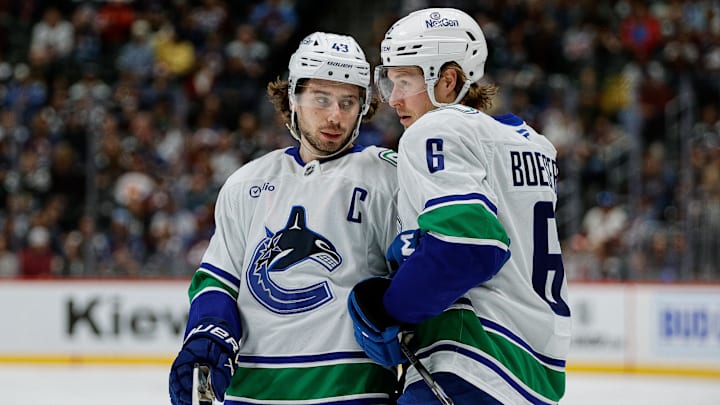 Apr 10, 2025; Denver, Colorado, USA; Vancouver Canucks defenseman Quinn Hughes (43) and right wing Brock Boeser (6) in the first period against the Colorado Avalanche at Ball Arena. Mandatory Credit: Isaiah J. Downing-Imagn Images