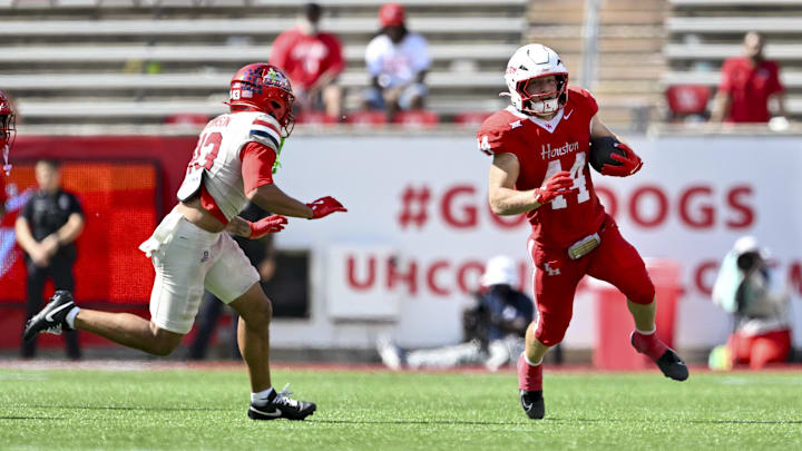 Oct 18, 2025; Houston, Texas, USA; Houston Cougars running back Dean Connors (44) runs the ball during the fourth quarter against the Arizona Wildcats at TDECU Stadium. Mandatory Credit: Maria Lysaker-Imagn Images 