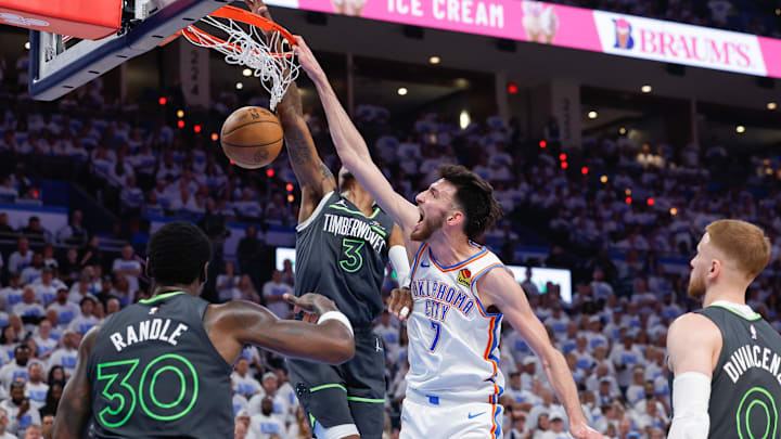 May 20, 2025; Oklahoma City, Oklahoma, USA; Oklahoma City Thunder forward Chet Holmgren (7) dunks beside Minnesota Timberwolves forward Jaden McDaniels (3) in the fourth quarter during Game 1 of the Western Conference Finals at Paycom Center. Mandatory Credit: Alonzo Adams-Imagn Images