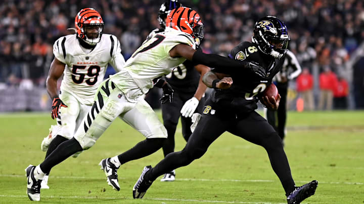 Cincinnati Bengals safety Jordan Battle (27) tackles Baltimore Ravens quarterback Lamar Jackson (8) during the fourth quarter at M&T Bank Stadium. Cincinnati Bengals safety Jordan Battle (27) tackles Baltimore Ravens quarterback Lamar Jackson (8) during the fourth quarter at M&T Bank Stadium.