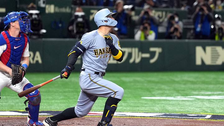 Mar 16, 2025; Bunkyo, Tokyo, Japan; Hanshin Tigers third baseman Teruaki Sato (8) hits a home run against the Los Angeles Dodgers during the fourth inning at Tokyo Dome. Mandatory Credit: Darren Yamashita-Imagn Images Mar 16, 2025; Bunkyo, Tokyo, Japan; Hanshin Tigers third baseman Teruaki Sato (8) hits a home run against the Los Angeles Dodgers during the fourth inning at Tokyo Dome. Mandatory Credit: Darren Yamashita-Imagn Images