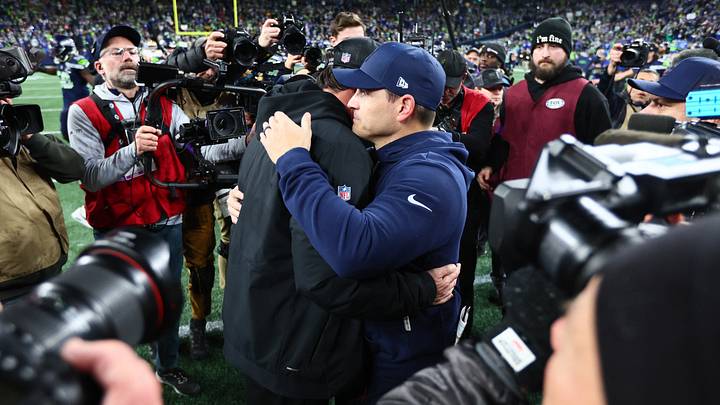 San Francisco 49ers head coach Kyle Shanahan and Seattle Seahawks head coach Mike MacDonald meet at midfield following an NFC Divisional Round game. San Francisco 49ers head coach Kyle Shanahan and Seattle Seahawks head coach Mike MacDonald meet at midfield following an NFC Divisional Round game.