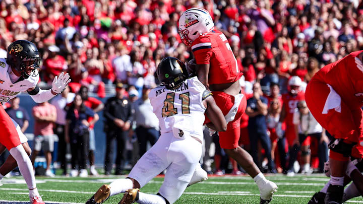 Oct 19, 2024; Tucson, Arizona, USA; Colorado Buffaloes inside linebacker Nikhai Hill-Green (41) stops Arizona Wildcats running back Quali Conley (7) from scoring during the first quarter at Arizona Stadium. Mandatory Credit: Aryanna Frank-Imagn Images