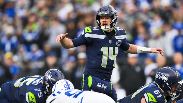 Dec 14, 2025; Seattle, Washington, USA; Seattle Seahawks quarterback Sam Darnold (14) audibles over center against the Indianapolis Colts during the third quarter at Lumen Field. Mandatory Credit: Steven Bisig-Imagn Images