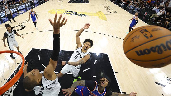 Jun 13, 2026; San Antonio, Texas, USA; San Antonio Spurs forward Victor Wembanyama (1) and guard Dylan Harper (2) and New York Knicks guard Jordan Clarkson (00) battle for the rebound during game five of the 2026 NBA Finals at Frost Bank Center. Mandatory Credit: Geoff Burke-Pool Photo via Imagn Images