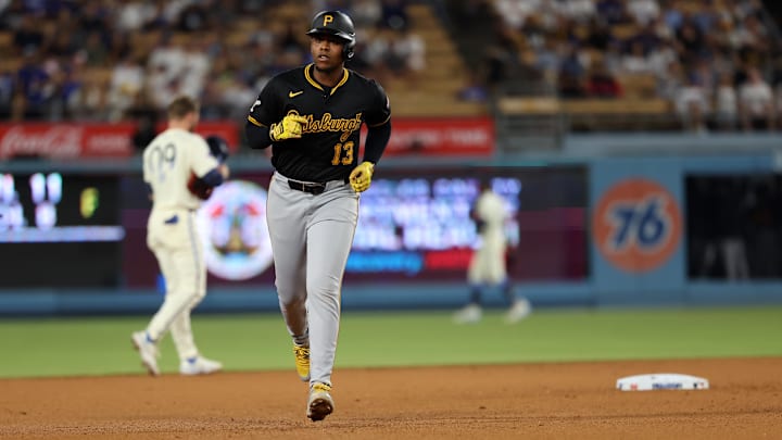 Pittsburgh Pirates third baseman Ke'Bryan Hayes (13) runs around bases after hitting a home run during the ninth inning against the Los Angeles Dodgers at Dodger Stadium. 