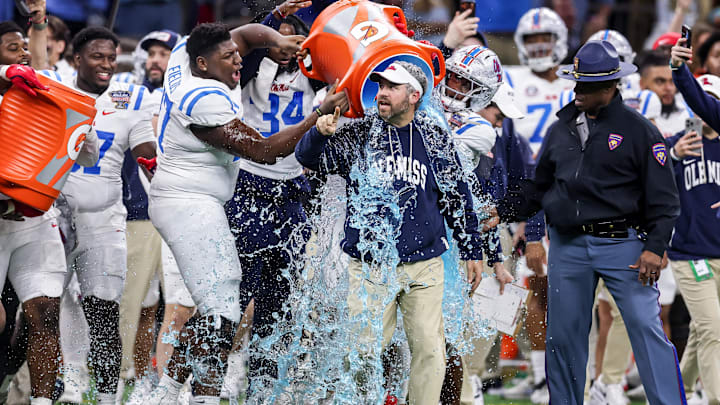 Jan 1, 2026; New Orleans, LA, USA; Mississippi Rebels players pour Gatorade on head coach Pete Golding near the end of the fourth quarter during the 2025 Sugar Bowl and quarterfinal game of the College Football Playoff against the Georgia Bulldogs at Caesars Superdome. Mandatory Credit: Stephen Lew-Imagn Images