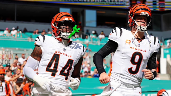 Dec 21, 2025; Miami Gardens, Florida, USA; Cincinnati Bengals quarterback Joe Burrow (9) and Cincinnati Bengals linebacker Demetrius Knight Jr. (44) enter the field before the game against the Miami Dolphins at Hard Rock Stadium. Mandatory Credit: Sam Navarro-Imagn Images