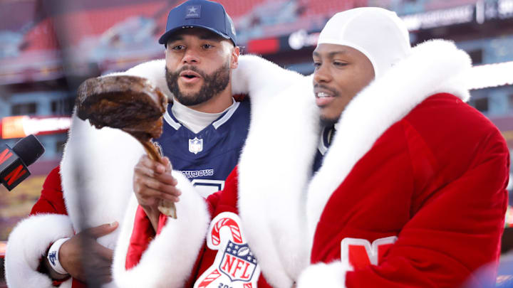 Dak Prescott and Dallas Cowboys receiver Kavontae Turpin react to the steak after the win over the Washington Commanders at Northwest Stadium. 