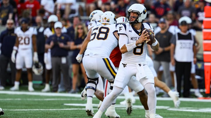 Oct 26, 2024; Tucson, Arizona, USA; West Virginia Mountaineers quarterback Nicco Marchiol (8) looks to throw the ball during the first quarter against the Arizona Wildcats at Arizona Stadium. Mandatory Credit: Aryanna Frank-Imagn Images
