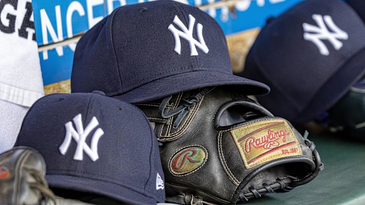 Apr 7, 2025; Detroit, Michigan, USA; New York Yankees baseball hats and gloves in the dugout out in the eighth inning against the Detroit Tigers at Comerica Park. Apr 7, 2025; Detroit, Michigan, USA; New York Yankees baseball hats and gloves in the dugout out in the eighth inning against the Detroit Tigers at Comerica Park.