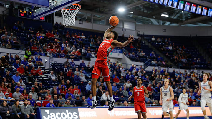 Jan 20, 2024; Colorado Springs, Colorado, USA; New Mexico Lobos guard Donovan Dent (2) dunks the ball in the second half against the Air Force Falcons at Clune Arena. Mandatory Credit: Isaiah J. Downing-Imagn Images