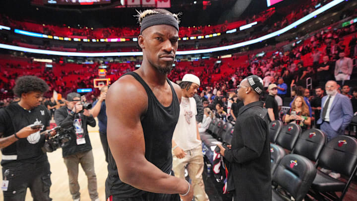 Jan 19, 2025; Miami, Florida, USA;  Miami Heat forward Jimmy Butler (22) walks off the court after greeting court-side friends following the victory over the San Antonio Spurs at Kaseya Center. Mandatory Credit: Jim Rassol-Imagn Images