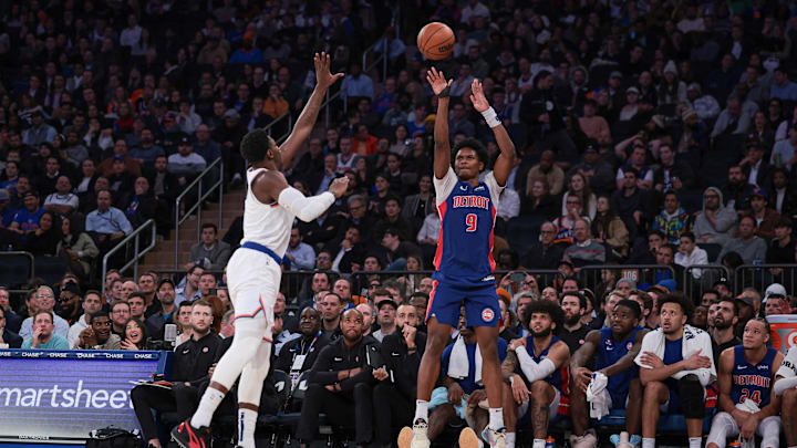 Nov 30, 2023; New York, New York, USA; Detroit Pistons forward Ausar Thompson (9) makes a three point basket during the second half as New York Knicks guard RJ Barrett (9) defends at Madison Square Garden. Mandatory Credit: Vincent Carchietta-Imagn Images