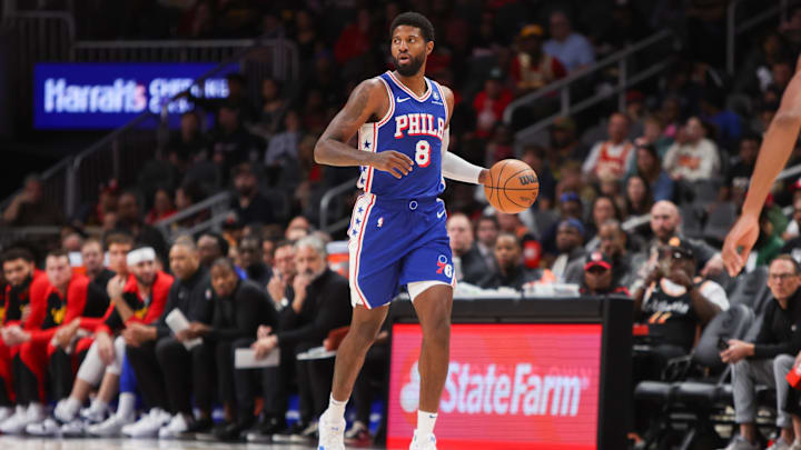 Oct 14, 2024; Atlanta, Georgia, USA; Philadelphia 76ers forward Paul George (8) dribbles against the Atlanta Hawks in the first quarter at State Farm Arena. Mandatory Credit: Brett Davis-Imagn Images