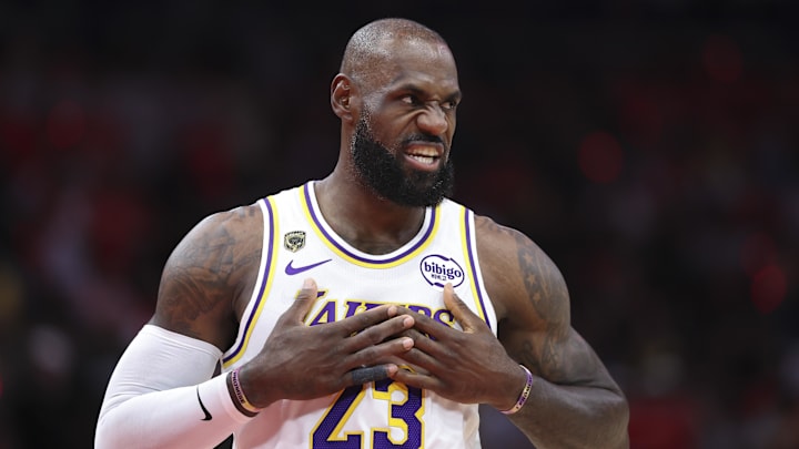 Lakers forward LeBron James walks on the court before the start of the game against the Rockets.