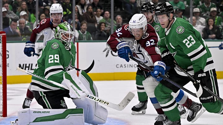 Mar 6, 2026; Dallas, Texas, USA; Colorado Avalanche left wing Gabriel Landeskog (92) and Dallas Stars defenseman Esa Lindell (23) battle for control of the puck during the game between the Stars and the Avalanche at American Airlines Center. Mandatory Credit: Jerome Miron-Imagn Images