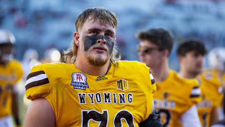 Dec 30, 2022; Tucson, AZ, USA; Wyoming Cowboys offensive tackle Caden Barnett (72) against the Ohio Bobcats during the 2022 Barstool Sports Arizona Bowl at Arizona Stadium. Mandatory Credit: Mark J. Rebilas-Imagn Images Dec 30, 2022; Tucson, AZ, USA; Wyoming Cowboys offensive tackle Caden Barnett (72) against the Ohio Bobcats during the 2022 Barstool Sports Arizona Bowl at Arizona Stadium. Mandatory Credit: Mark J. Rebilas-Imagn Images