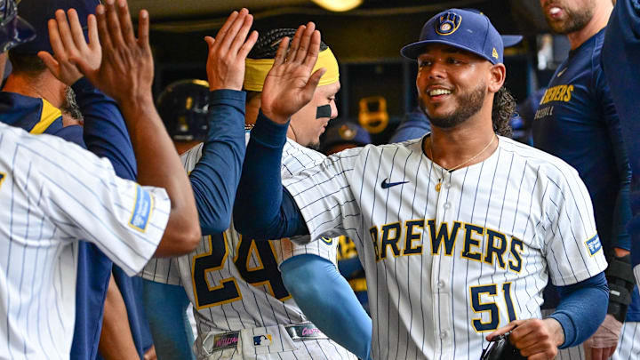 Jul 13, 2025; Milwaukee, Wisconsin, USA;  Milwaukee Brewers starting pitcher Freddy Peralta (51) is greeted in the dugout after pitching six plus innings against the Washington Nationals at American Family Field. Mandatory Credit: Benny Sieu-Imagn Images