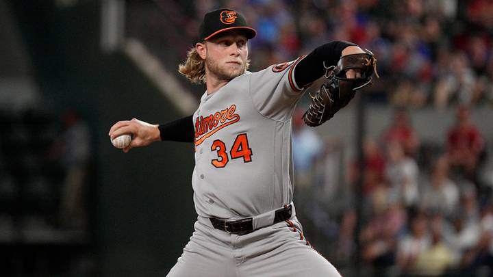 Aug 7, 2026; Arlington, Texas, USA; Baltimore Orioles pitcher Shane Baz (34) throws to the plate against the Texas Rangers during the first inning at Globe Life Field. Mandatory Credit: Raymond Carlin III-Imagn Images Aug 7, 2026; Arlington, Texas, USA; Baltimore Orioles pitcher Shane Baz (34) throws to the plate against the Texas Rangers during the first inning at Globe Life Field. Mandatory Credit: Raymond Carlin III-Imagn Images