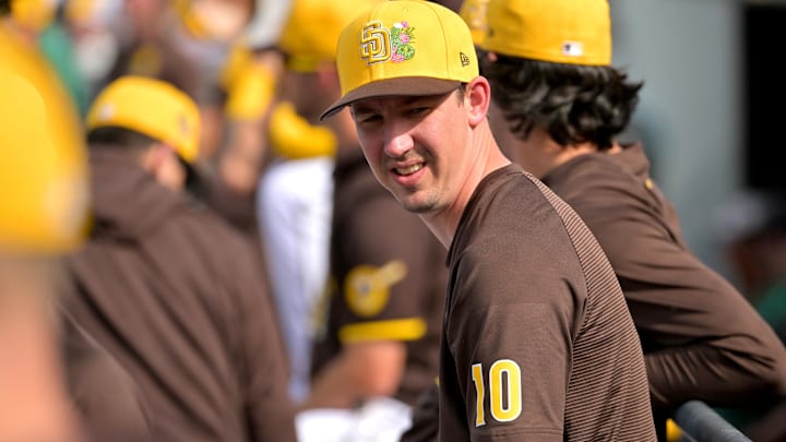 Feb 23, 2026; Peoria, Arizona, USA;  San Diego Padres pitcher Walker Buehler (10) looks on from the dugout in the fifth inning against the Milwaukee Brewers at Peoria Sports Complex. Mandatory Credit: Jayne Kamin-Oncea-Imagn Images