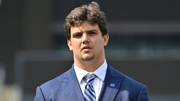 Apr 25, 2025; Foxborough, MA, USA; New England Patriots first round draft pick Will Campbell stands on the stage during a press conference on the game field at Gillette Stadium.  Mandatory Credit: Eric Canha-Imagn Images