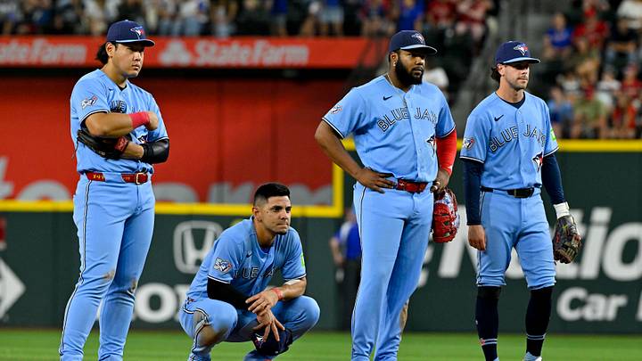 Toronto Blue Jays infielders looking on. Mandatory Credit: Jerome Miron-Imagn Images