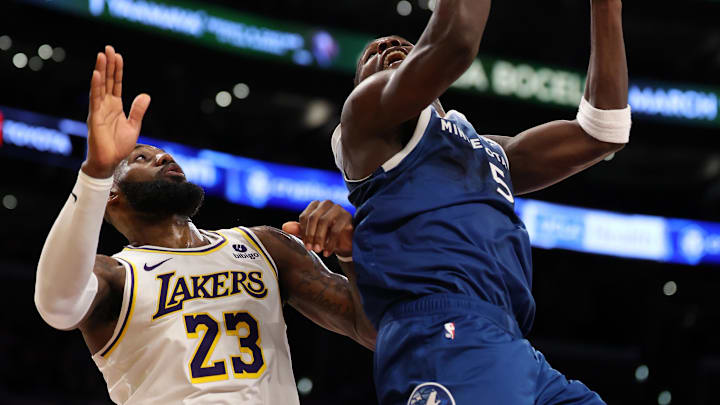 Mar 10, 2024; Los Angeles, California, USA;  Minnesota Timberwolves guard Anthony Edwards (5) shoots the ball against Los Angeles Lakers forward LeBron James (23) during the fourth quarter at Crypto.com Arena. Mandatory Credit: Kiyoshi Mio-Imagn Images
