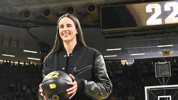 Feb 2, 2025; Iowa City, Iowa, USA; Former Iowa Hawkeyes player Caitlin Clark looks on after the game at Carver-Hawkeye Arena against the USC Trojans. The Hawkeyes retired Clark’s jersey after the game. Mandatory Credit: Jeffrey Becker-Imagn Images