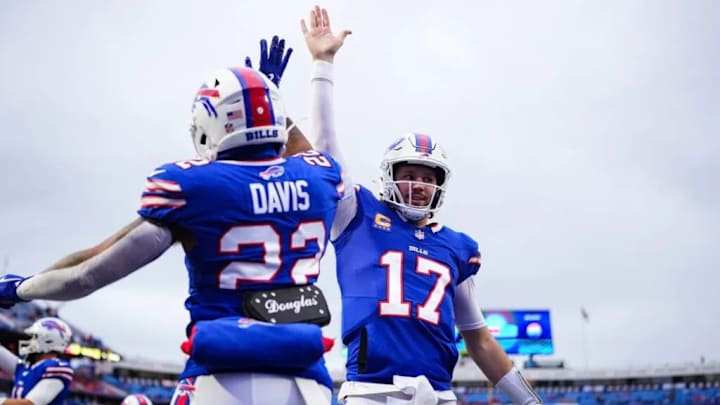 Bills RB Ray Davis and QB Josh Allen high-five before the Jets game on Sunday