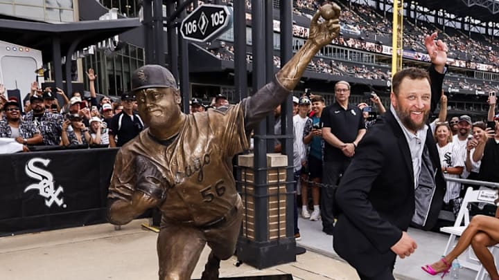 Chicago White Sox pitcher Mark Buehrle poses next to his statue, which was unveiled Friday at Rate Field.