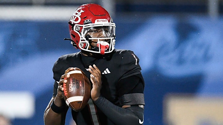 Champ Monds (1) of Vero Beach looks to pass in the FHSAA Class 7A state championship, Dec. 13, 2025, at Pitbull Stadium in Miami.