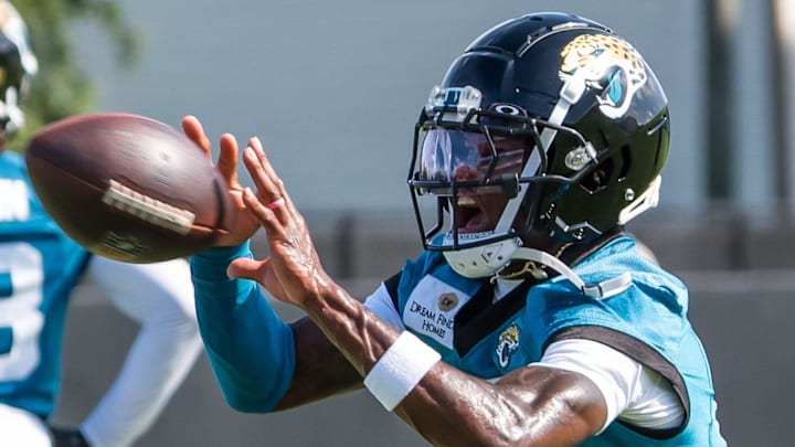 Jacksonville Jaguars wide receiver Travis Hunter catches a ball during minicamp. Jacksonville Jaguars wide receiver Travis Hunter catches a ball during minicamp.