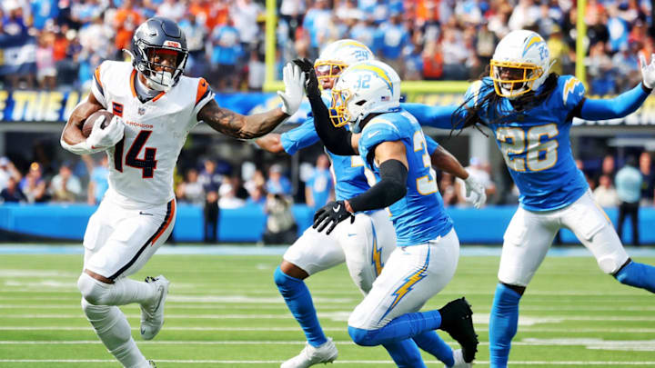 Sep 21, 2025; Inglewood, California, USA; Denver Broncos wide receiver Courtland Sutton (14) runs the ball during the second half against the Los Angeles Chargers at SoFi Stadium. Mandatory Credit: William Navarro-Imagn Images