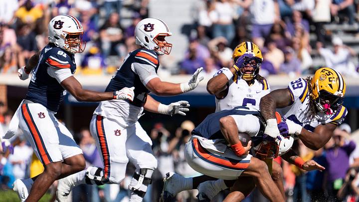 Auburn Tigers quarterback Byrum Brown (17) is sacked by LSU Tigers defensive tackle Deuce Geralds (99) as Auburn Tigers take on LSU Tigers at Jordan-Hare Stadium in Auburn, Ala. on Saturday, Oct. 24, 2026. LSU Tigers defeated Auburn Tigers 38-17.