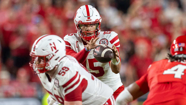 Nebraska quarterback Dylan Raiola takes snap while offensive lineman Henry Lutovsky prepares to protect against Cincinnati in Kansas City. Nebraska quarterback Dylan Raiola takes snap while offensive lineman Henry Lutovsky prepares to protect against Cincinnati in Kansas City.