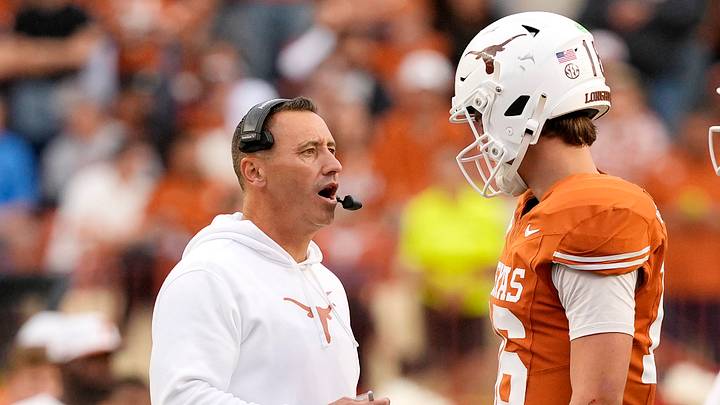Texas Longhorns head coach Steve Sarkisian talks with quarterback Arch Manning (16) during a timeout in the second half against the Vanderbilt Commodores at Darrell K Royal-Texas Memorial Stadium. 