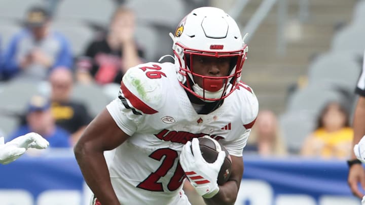 Sep 27, 2025; Pittsburgh, Pennsylvania, USA;  Louisville Cardinals running back Duke Watson (26) runs the ball against the Pittsburgh Panthers during the fourth quarter at Acrisure Stadium. Mandatory Credit: Charles LeClaire-Imagn Images