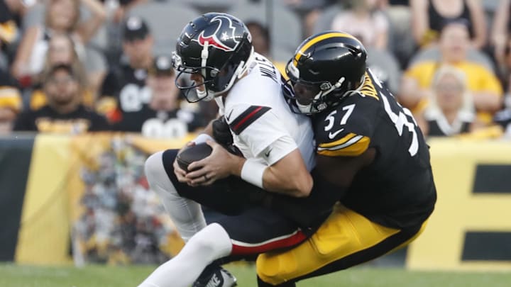 Aug 9, 2024; Pittsburgh, Pennsylvania, USA;  Houston Texans quarterback Davis Mills (10) is sacked by Pittsburgh Steelers defensive tackle Montravius Adams (57) during the second quarter at Acrisure Stadium. Mandatory Credit: Charles LeClaire-Imagn Images