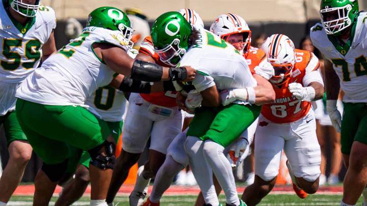 Oregon quarterback Dante Moore is sacked as the Oregon Ducks face the Oklahoma State Cowboys on Sept. 12, 2026, at Boone Pickens Stadium in Stillwater, Oklahoma. Oregon quarterback Dante Moore is sacked as the Oregon Ducks face the Oklahoma State Cowboys on Sept. 12, 2026, at Boone Pickens Stadium in Stillwater, Oklahoma.