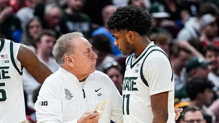 Michigan State head coach Tom Izzo talks to guard Jase Richardson (11) at a timeout against Bryant during the second half of the First Round of NCAA Tournament at Rocket Arena in Cleveland, Ohio on Friday, March 21, 2025.