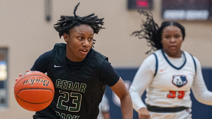 Cedar Park's Hope Edwards (23) dribbles up the court against Glenn last month.