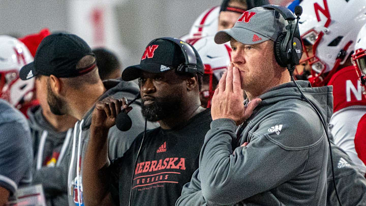 Sep 10, 2022; Lincoln, Nebraska, USA; Nebraska Cornhuskers head coach Scott Frost (right) watches from the sideline during the second quarter against the Georgia Southern Eagles at Memorial Stadium. 