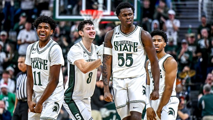 Michigan State's Coen Carr, center, celebrates with, from left, Jase Richardson, Frankie Fidler and Jaden Akins after Carr's 3-pointer against Florida Atlantic during the second half on Saturday, Dec. 21, 2024, in East Lansing.