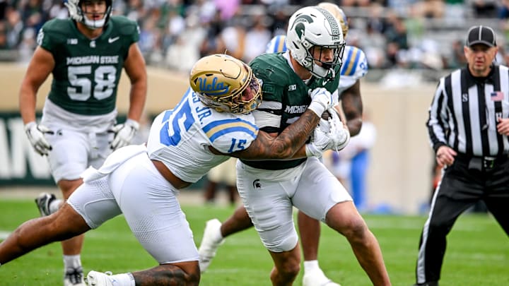 Michigan State's Jack Velling, right, runs after a catch as UCLA's Anthony Jones attempts the tackle during the first quarter on Saturday, Oct. 11, 2025, at Spartan Stadium in East Lansing. Michigan State's Jack Velling, right, runs after a catch as UCLA's Anthony Jones attempts the tackle during the first quarter on Saturday, Oct. 11, 2025, at Spartan Stadium in East Lansing.