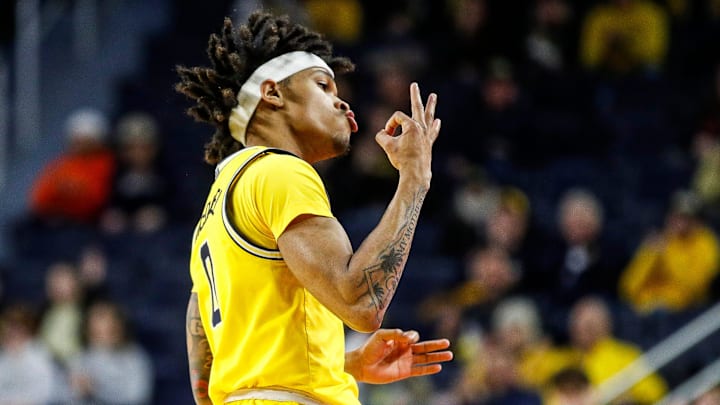 Michigan guard Dug McDaniel (0) celebrates a three point basket against Nebraska during the first half at Crisler Center in Ann Arbor on Sunday, March 10, 2024.