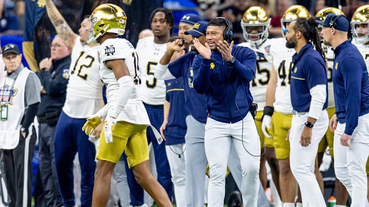 Jan 2, 2025; New Orleans, LA, USA;  Notre Dame Fighting Irish head coach Marcus Freeman reacts to a play against the Georgia Bulldogs during the first half at Caesars Superdome. Mandatory Credit: Stephen Lew-Imagn Images