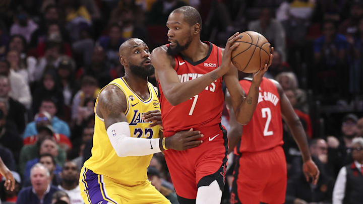 Mar 16, 2026; Houston, Texas, USA; Los Angeles Lakers forward LeBron James (23) defends against Houston Rockets forward Kevin Durant (7) during the fourth quarter at Toyota Center. Mandatory Credit: Troy Taormina-Imagn Images