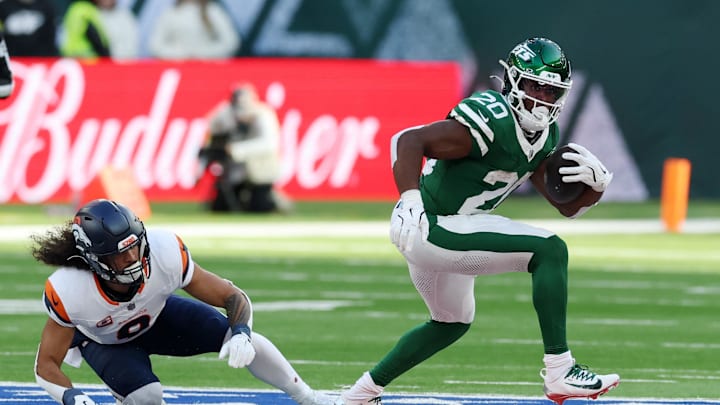 [US, Mexico & Canada customers only] Oct 12, 2025; Tottenham, UNITED KINGDOM; New York Jets running back Breece Hall (20) runs the ball against the Denver Broncos during an NFL International Series game at Tottenham Hotspur Stadium. Mandatory Credit: Paul Childs/Reuters via Imagn Images